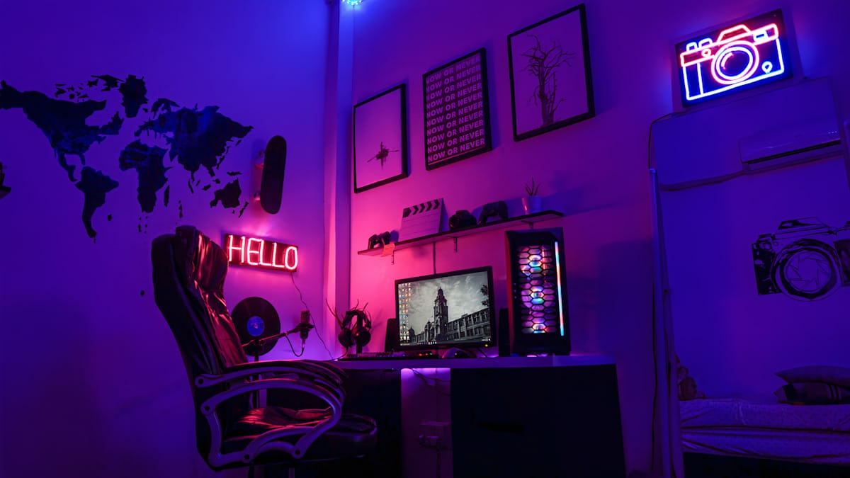 Gamer exploring mobile games on a neon-lit setup